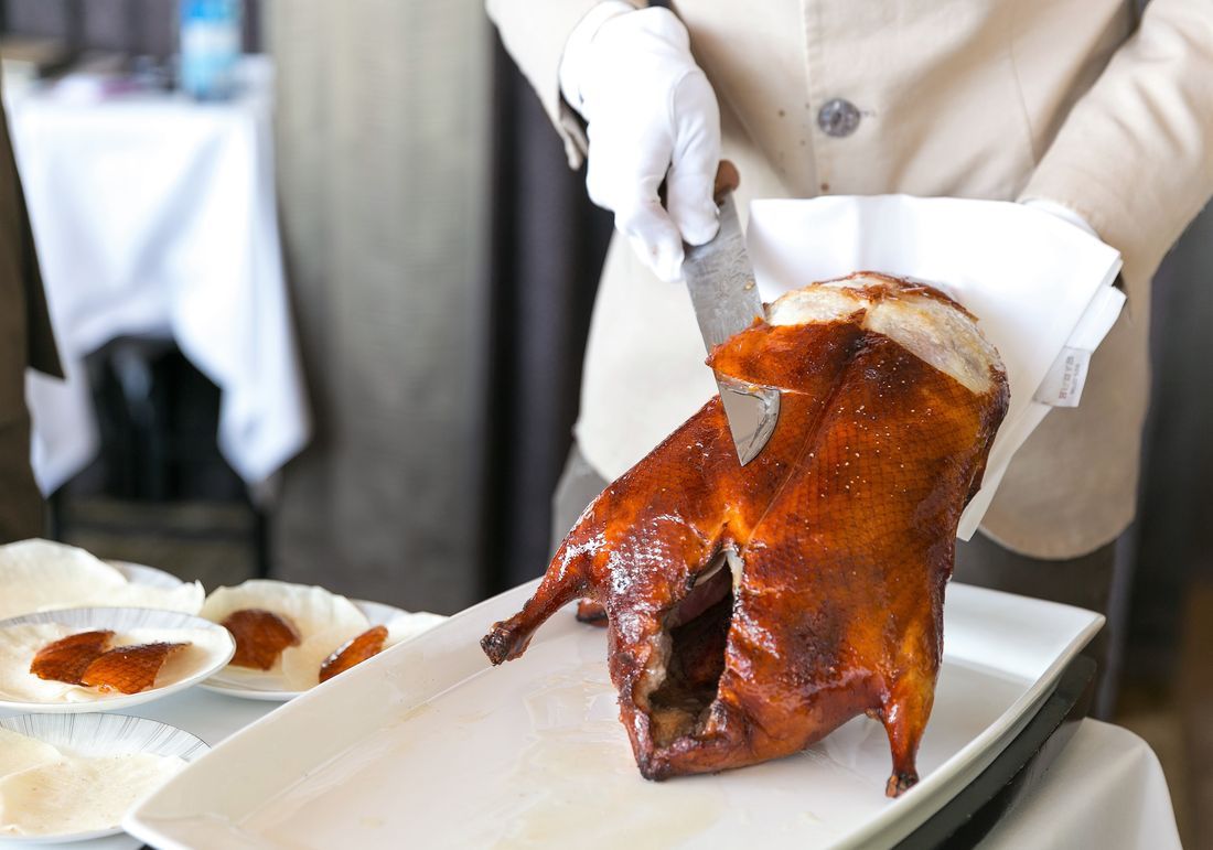 Charcoal roast duck with crackling skin, carved and plated