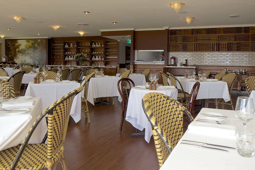 Dining room with warm lighting and wooden tables